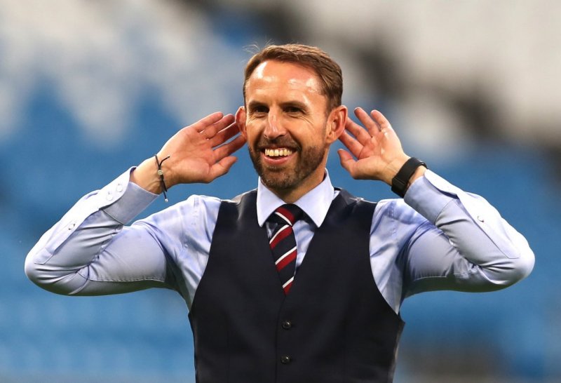 Gareth Southgate, the coach of England's national football team, English players kneel before the match against Iran