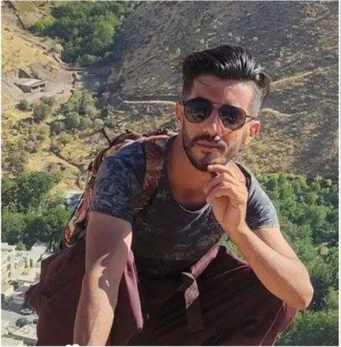Fardin Rostamnejad, a 25-year-old Kurdish porter, paralyzed