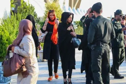 Tasnim walks without a hijab, earning $5 per hour