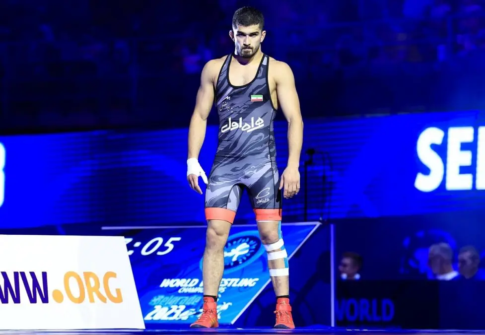 Awarding a Quarter Coin to the Asian Games Wrestling Champion