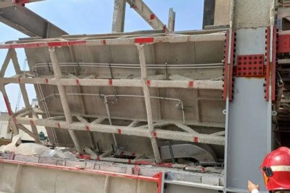 Building roof collapse in progress on Mirdamad Street, Tehran