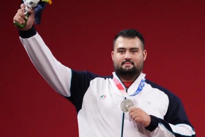Ali Davoudi, Iranian weightlifter, reached the runner-up position and secured his quota for the Olympics