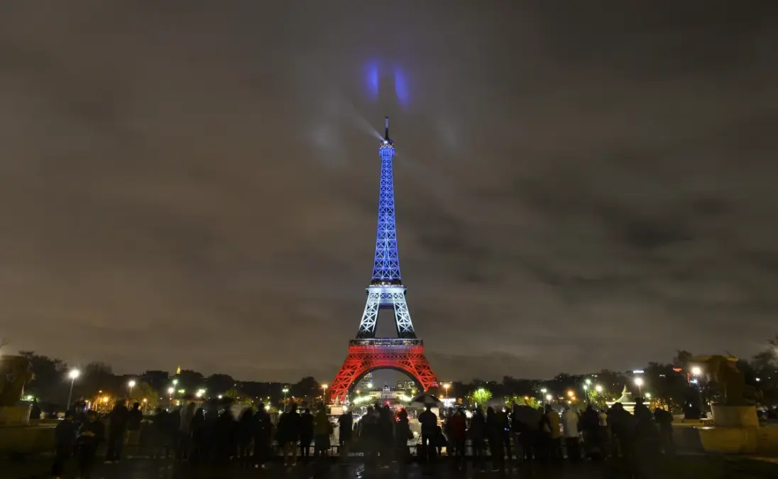 Eiffel Tower Illuminated in French Flag Colors on Anniversary of ISIS Attacks in Paris
